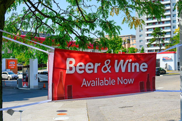 A public banner announcing beer and wine are now available.