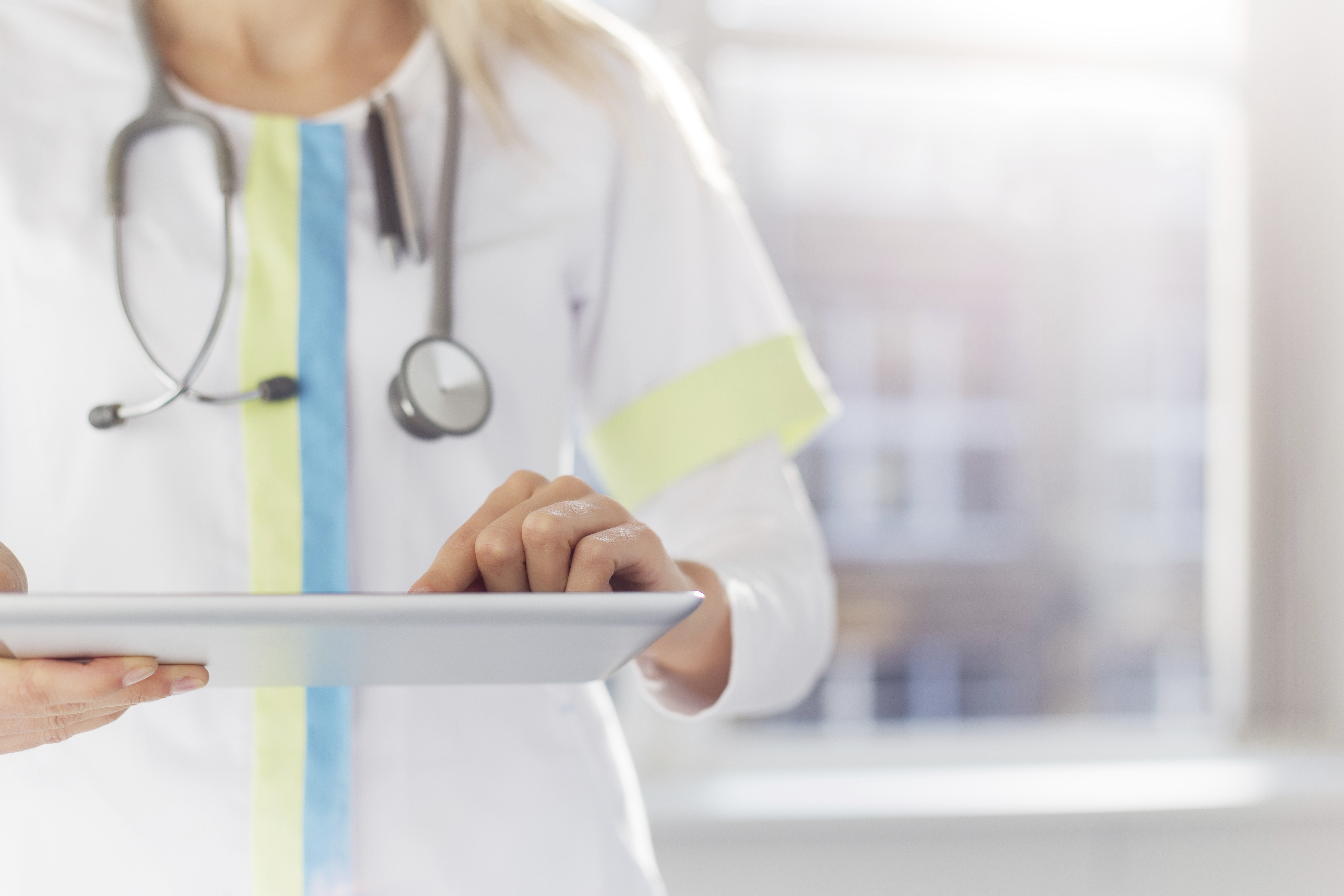 Healthcare provider holding a clipboard.
