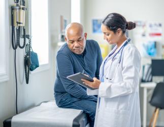 Physician discussing treatment plan with patient.