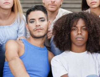 Group of diverse youth sitting together.