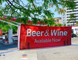 A public banner announcing beer and wine are now available.