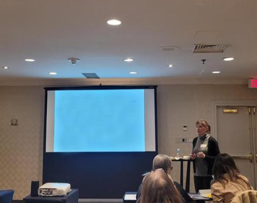 Woman gives presentation at workshop