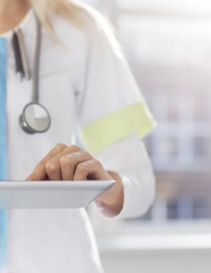 Healthcare provider holding a clipboard.