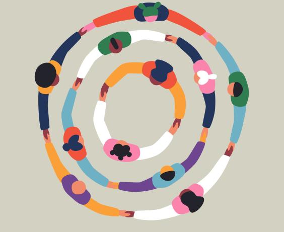 Diverse group of people holding hands in a circle.