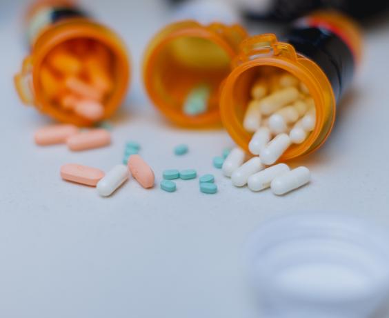 Several opened bottles of prescription drugs.