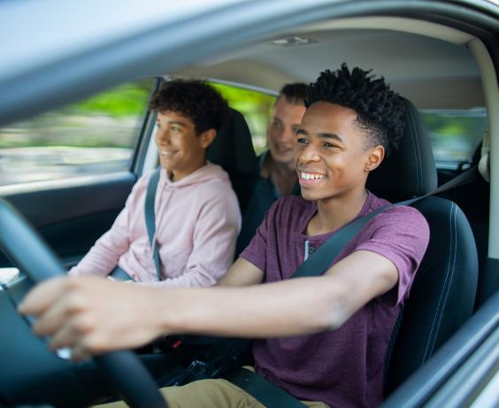 Youth driving in a car.