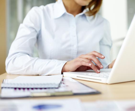 A person working on their laptop.